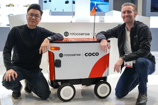 RoboSense CEO Mark Qiu and Coco Robotics Co-founder and CEO Zach Rash pictured together at CES 2025.