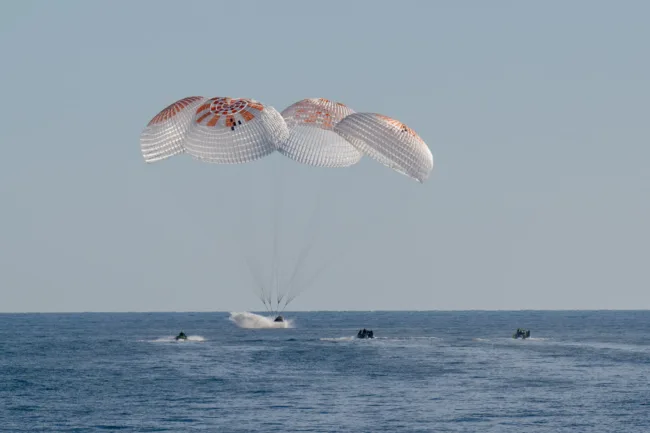 NASA astronauts return to Earth after a nine-month ISS mission as SpaceX Dragon Freedom splashes down off Florida.