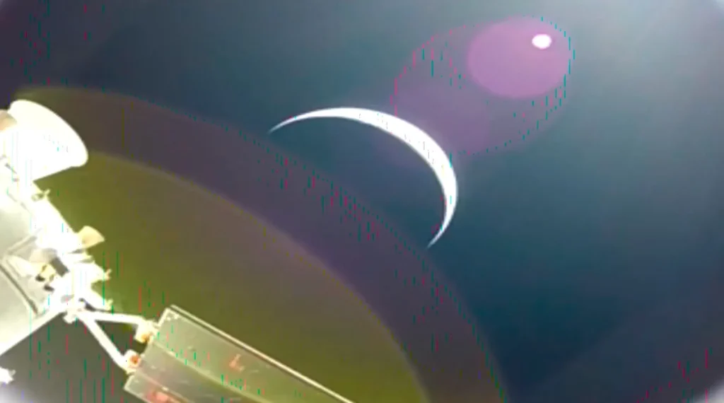 Earth's crescent captured from Orion's solar array camera on day one of NASA Artemis II — the first crewed mission to leave Earth orbit since Apollo 17 in 1972.