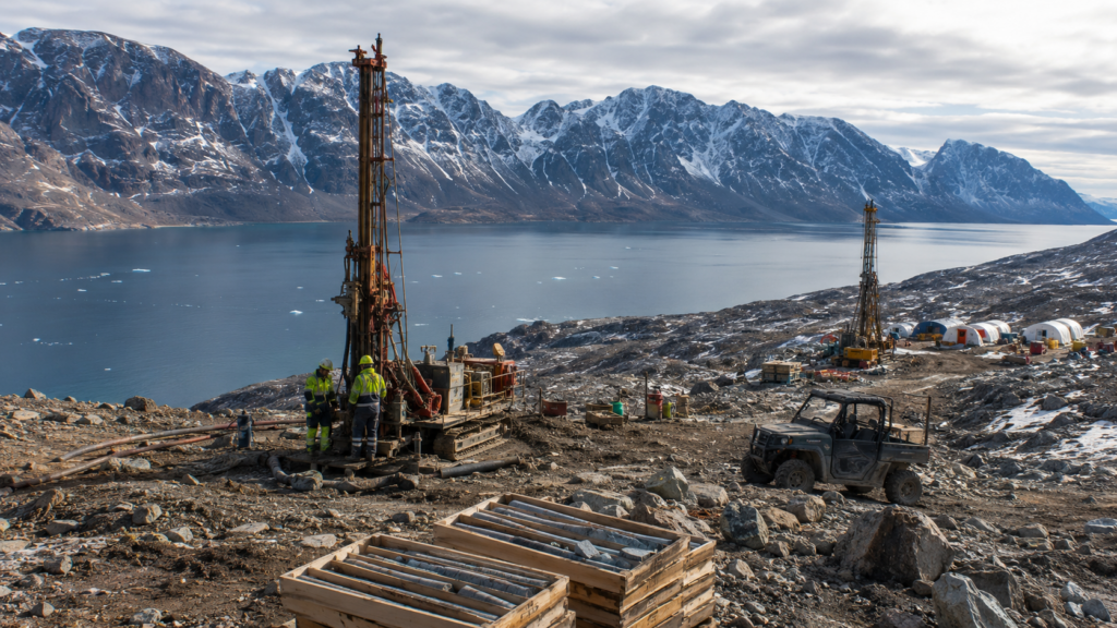Representative image: Arctic drilling rigs and core sample boxes illustrate Greenland Mines’ push to acquire the Sarfartoq rare earths project, a potential neodymium-praseodymium supply chain asset in Greenland’s critical minerals race.