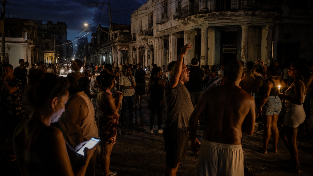 Representative image: Cuba’s partial power grid collapse has intensified blackout pressure across Havana and eastern provinces, with residents gathering in darkened streets as fuel shortages deepen the island’s electricity crisis and trigger fresh protests.