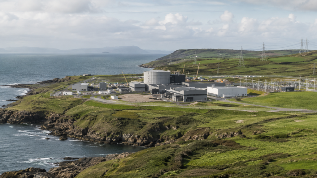 Representative image of a coastal nuclear site in North Wales, illustrating how the Wylfa SMR Project is moving into focus in 2026 as the UK advances its first Rolls-Royce small modular reactor fleet.