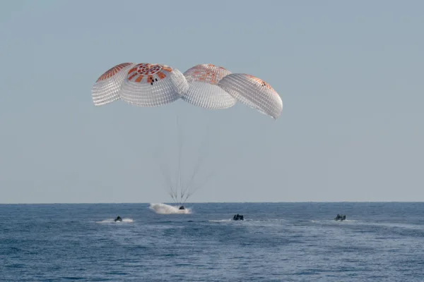 NASA astronauts return to Earth after a nine-month ISS mission as SpaceX Dragon Freedom splashes down off Florida.