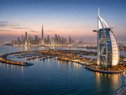 Representative image of Dubai’s skyline featuring the Burj Al Arab and Palm Jumeirah, as global markets watch closely following reports of Iranian missile and drone strikes targeting key infrastructure across the United Arab Emirates.