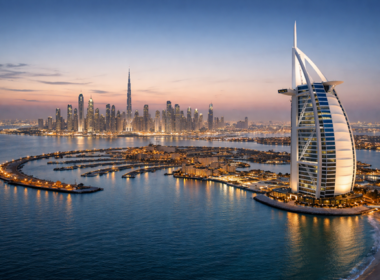 Representative image of Dubai’s skyline featuring the Burj Al Arab and Palm Jumeirah, as global markets watch closely following reports of Iranian missile and drone strikes targeting key infrastructure across the United Arab Emirates.