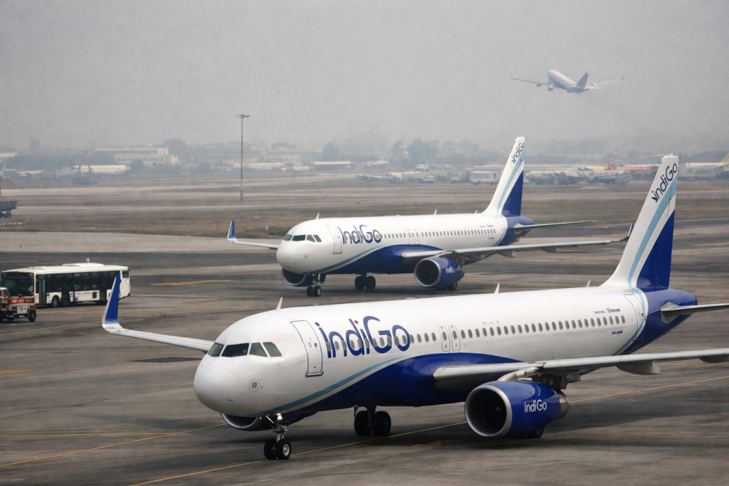 Representative image of grounded passenger aircraft at an Indian airport, illustrating the story on how soaring fuel costs, Gulf airspace disruption, and Directorate General of Civil Aviation schedule cuts are worsening the summer 2026 crisis for Indian airlines.