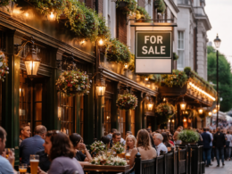 Greene King pub estate overhaul in the UK: A representative image of a traditional British pub with a ‘for sale’ sign, reflecting plans to sell 150 pubs and convert 300 sites amid industry restructuring.