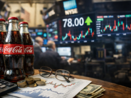 Representative image of Coca-Cola bottles and market charts illustrating investor focus ahead of The Coca-Cola Company’s April 28 earnings report under new chief executive Henrique Braun.