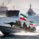 Representative image of military and commercial vessels near the Strait of Hormuz, illustrating Iran’s renewed control measures after reversing its brief claim that the waterway was fully open to commercial shipping.