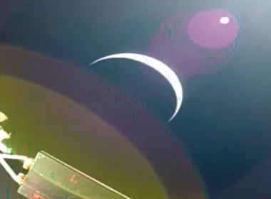 Earth's crescent captured from Orion's solar array camera on day one of NASA Artemis II — the first crewed mission to leave Earth orbit since Apollo 17 in 1972.