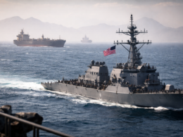 Representative image of a United States Navy warship and commercial tanker traffic near the Strait of Hormuz, illustrating the first full operational day of the United States naval blockade of Iranian ports and the rising global focus on Gulf shipping disruption.