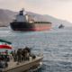 Representative image of commercial shipping and naval activity in the Strait of Hormuz, as Iran reopens the key oil transit route while uncertainty over the United States naval blockade continues.
