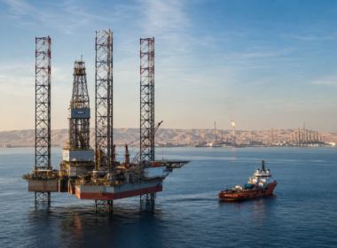 Representative image of an offshore jack-up drilling rig and support vessel in Gulf waters, reflecting ADNOC Drilling’s record Q1 2026 performance, strong rig utilisation, integrated oilfield services growth, and expanding regional energy platform.