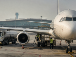 Representative image of an aircraft being serviced on an airport tarmac as Delhi cuts aviation turbine fuel VAT from 25% to 7%, a move aimed at easing airline cost pressure and strengthening the capital’s aviation hub competitiveness.