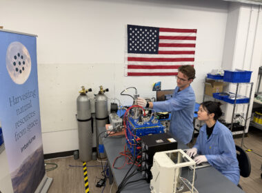 Interlune test engineer Alex Lewandowski and mechanical engineer Jessica Wu check mass spectrometer test equipment in Seattle as NASA’s $6.9 million award pushes lunar helium-3 extraction closer to its first commercial test.