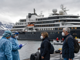 Representative image: Health workers screen masked cruise passengers at a cold-weather port as authorities trace a rare hantavirus-linked illness cluster tied to an expedition cruise ship, highlighting why the WHO says the rodent-borne virus outbreak is serious but not the start of a new pandemic.