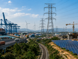 Representative image of industrial infrastructure, solar panels, transmission lines and port logistics, illustrating Adani Portfolio’s FY26 capex surge and India’s infrastructure investment story.
