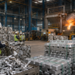 Representative image of aluminium scrap, recycled metal ingots and workers inside a processing facility, illustrating the CMR Green Technologies IPO and India’s metal recycling sector.