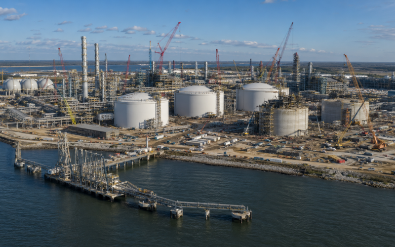 Representative image of a large LNG export terminal under construction along a waterfront. The visual reflects how Cheniere’s Sabine Pass expansion and Bechtel’s $4.69 billion EPC contract could strengthen U.S. LNG export infrastructure and reshape global energy supply strategy.