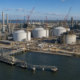 Representative image of a large LNG export terminal under construction along a waterfront. The visual reflects how Cheniere’s Sabine Pass expansion and Bechtel’s $4.69 billion EPC contract could strengthen U.S. LNG export infrastructure and reshape global energy supply strategy.