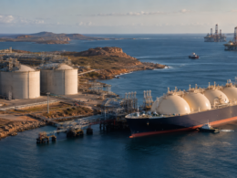 Representative image: Coastal LNG terminal and tanker infrastructure illustrate ExxonMobil’s reported Woodside Energy review, as LNG consolidation, Australia energy assets and XOM stock sentiment move into focus.