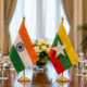 Representative image of India and Myanmar flags on a diplomatic meeting table as Narendra Modi and U Min Aung Hlaing discuss border security, Northeast stability, trade, connectivity and assurances that Myanmar territory will not be used against India.