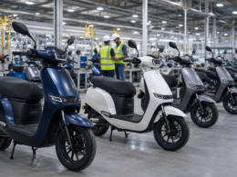 Representative image of unbranded electric scooters in a factory, illustrating Ola Electric’s QIP fundraise and India’s fast-growing EV two-wheeler market.