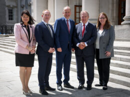 OpenText’s €105 million Ireland AI investment gains high-level government backing as Taoiseach Micheál Martin and IDA Ireland CEO Michael Lohan join OpenText executives to announce 400 new jobs in Cork and Galway for agentic AI, sovereign cloud and cybersecurity expansion in Europe. Pictured from left are Anne Marie Tierney Le Roux, Head of Technology at IDA Ireland; Michael Lohan, CEO of IDA Ireland; Taoiseach Micheál Martin TD; Thomas Jenkins, Chairman of OpenText; and Shannon Bell, Chief Digital Officer and Chief Information Officer of OpenText.