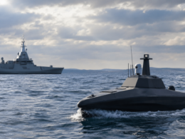 Representative image: An autonomous naval drone operating alongside a warship reflects Safran’s proposed €2.24 billion acquisition of Exail Technologies and the growing strategic value of maritime robotics in European defense.