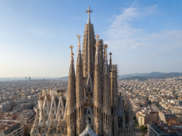 Representative image of Sagrada Família rising above Barcelona, illustrating the basilica’s Tower of Jesus Christ milestone as Antoni Gaudí’s unfinished masterpiece becomes a global test of heritage, tourism, faith, and urban planning.