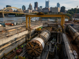 Representative image of tunnel construction near an urban riverfront, as Webuild S.p.A.’s Lane-Brayman joint venture advances Pittsburgh’s $1 billion Ohio River Tunnel project for cleaner waterways and resilient infrastructure.