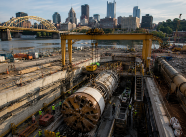 Representative image of tunnel construction near an urban riverfront, as Webuild S.p.A.’s Lane-Brayman joint venture advances Pittsburgh’s $1 billion Ohio River Tunnel project for cleaner waterways and resilient infrastructure.