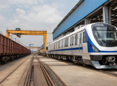 Representative image of a rail manufacturing yard with modern passenger coaches and freight wagons, illustrating Titagarh Rail Systems’ Q4 FY26 execution challenge as investors track its order book, Vande Bharat pipeline and railway manufacturing growth outlook.