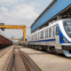 Representative image of a rail manufacturing yard with modern passenger coaches and freight wagons, illustrating Titagarh Rail Systems’ Q4 FY26 execution challenge as investors track its order book, Vande Bharat pipeline and railway manufacturing growth outlook.