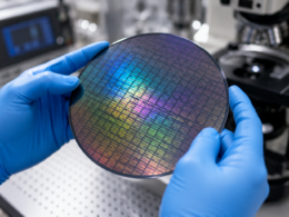 Representative image of semiconductor wafer inspection, highlighting the IQE and Tower Semiconductor supply agreement for AI data centre photonics, Indium Phosphide epiwafers and silicon photonics growth.