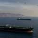 Representative image: Oil tankers and naval patrol vessels near a strategic Gulf shipping route highlight how Strait of Hormuz tensions are shaping the proposed United States and Iran peace deal.