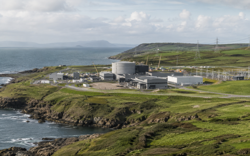 Representative image of a coastal nuclear site in North Wales, illustrating how the Wylfa SMR Project is moving into focus in 2026 as the UK advances its first Rolls-Royce small modular reactor fleet.