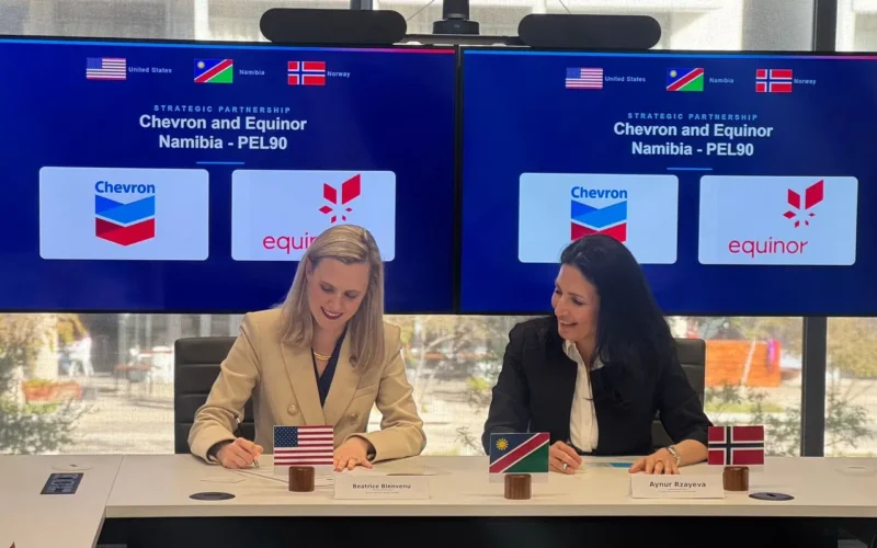 Beatrice Bienvenu, left, Country Manager Namibia for Chevron, and Aynur Rzayeva, Namibia Asset Manager for Equinor, sign the agreement in Windhoek as Equinor enters Namibia with a 17.4% stake in Chevron-operated PEL 90 ahead of the Orange Basin’s next drilling catalyst. Photo: Fabio Pezzotti.