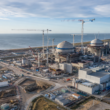 Coastal nuclear power plant construction site in the UK, illustrating how the £38.2bn Sizewell C Nuclear Project in Suffolk aims to deliver 3.2GW of low-carbon electricity by its 2039 operating baseline. Representative image.