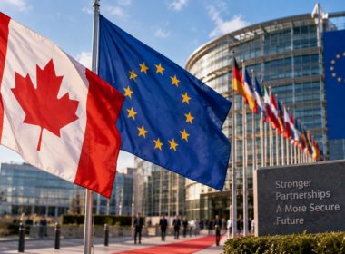 Canadian and European Union flags outside a diplomatic institution illustrate Canada’s exploratory push for deeper economic and strategic ties with the European Union as Prime Minister Mark Carney weighs possible associate membership amid strained United States trade relations. Representative image.